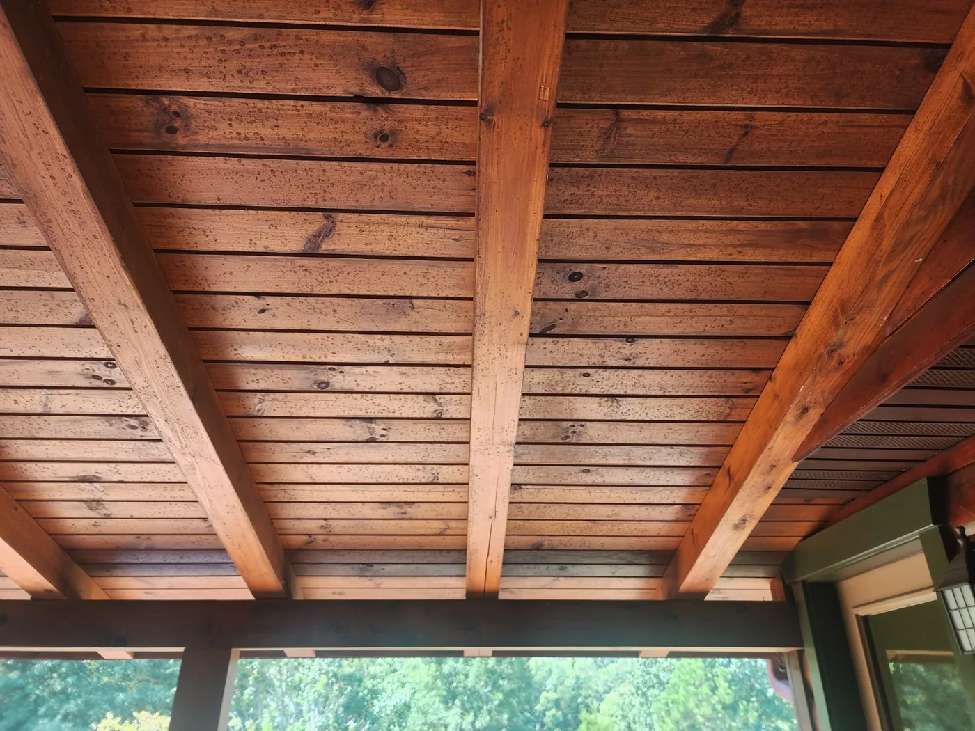 Before cleaning: spotted wood porch ceiling