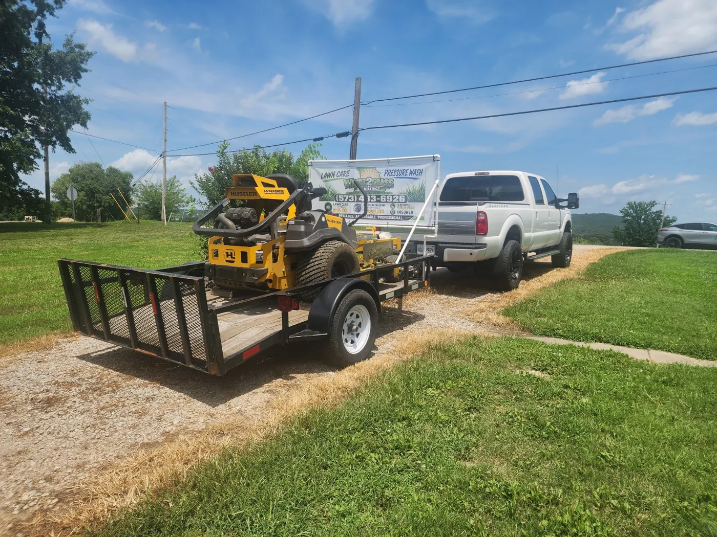 WEEDZ2GRASS lawn care truck and mowing equipment